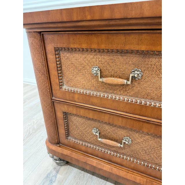 Thomasville Ernest Hemingway Dresser.Features two large dovetailed woven rattan drawers fronts. It is crafted with...