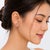 Elegant 14K pink rose gold lever-back earrings featuring a floral flower design set with brilliant white diamonds totaling...