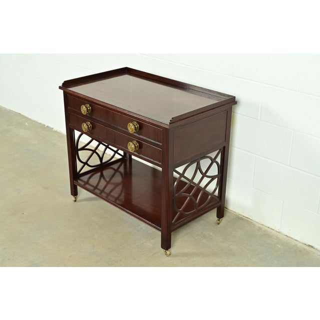 A gorgeous Chippendale or Georgian style rolling buffet server, credenza, or bar cart By Baker Furniture, "Historic...