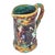 Vintage Majolica festival pitcher with vine handle and spout. Depicts figures dancing and celebrating a festival. No...