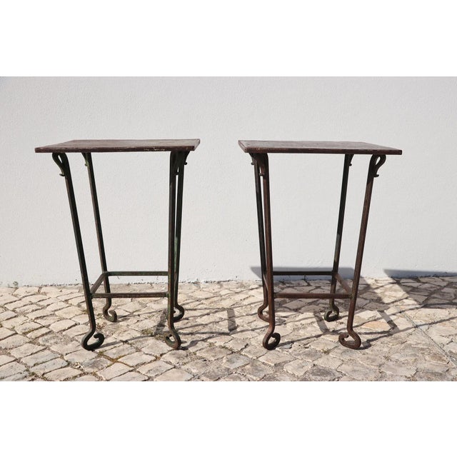 A Rare Set of Two Baroque Handmade Wrought Iron Garden Tables from the 19th Century with a exquisite patina. Circa: 19th...