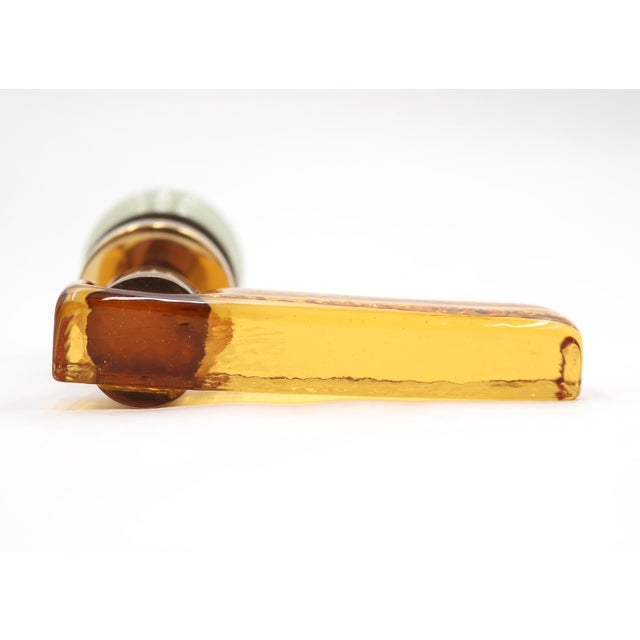 Mid Century style European made passage door lever set made of a smoky green glass knob and an orange Lucite lever. The...