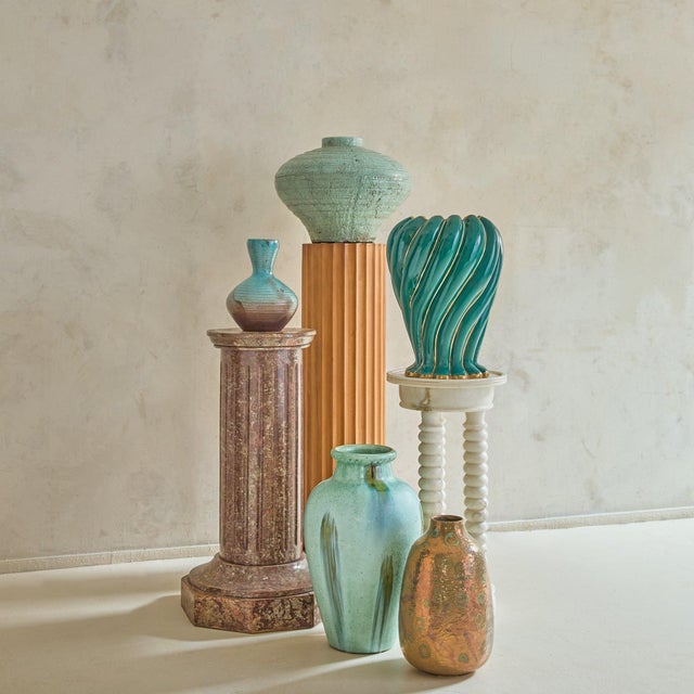 An Italian ceramic vase from the 1950s, signed “Deruta Italy 58.” The softly tapering form is articulated with twisting...
