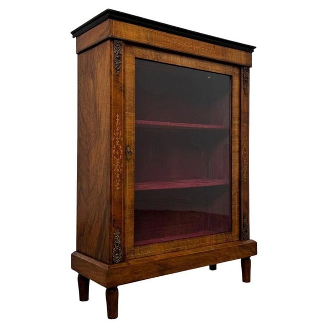 An elegant and highly decorative 19th-century English Victorian pier cabinet, beautifully crafted in walnut and...