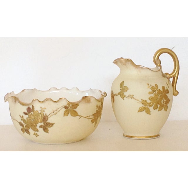 This creamer and open sugar made by the Belleck company in about 1890 with the associated mark on the bottom of each...