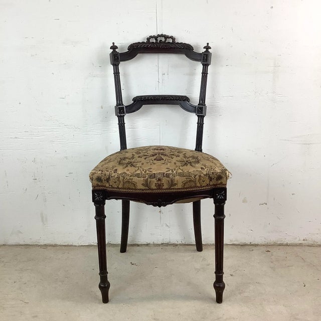 This petite vintage side chair captures the essence of Napoleon III style with its graceful proportions and refined...
