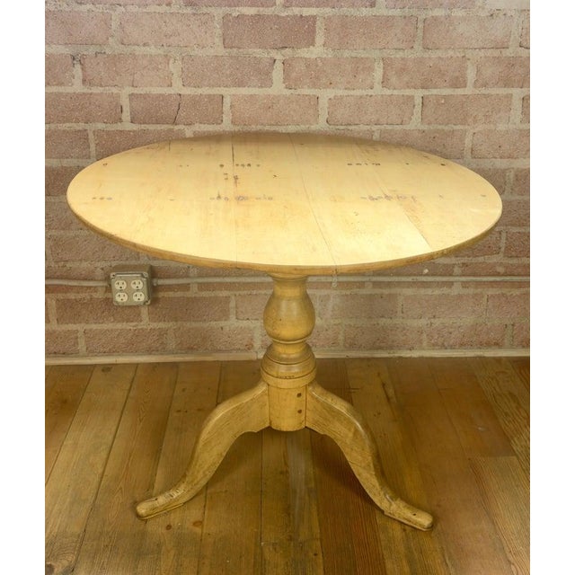 A sublime study in restraint and honest craftsmanship, this rare 19th-century Swedish tilt-top supper table embodies the...