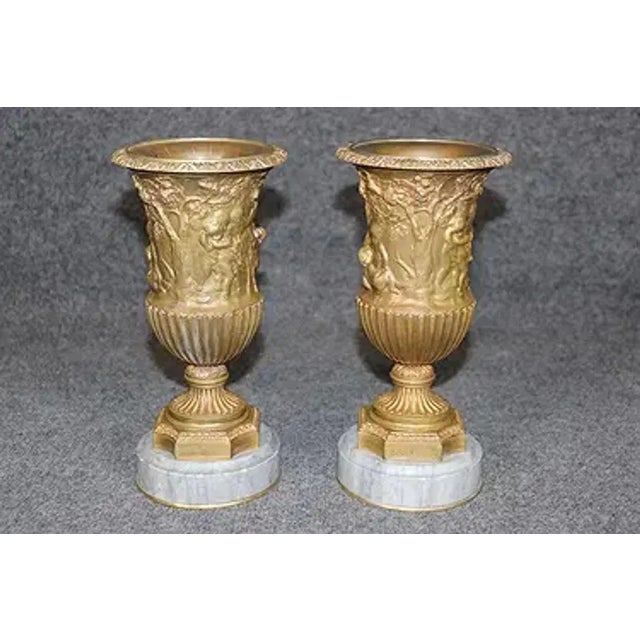 Good pair of 19th Century French gilt bronze compana vases on marble base. These vases were often used as mantel...