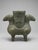 Offered here is a striking matched pair of archaistic Shang-style bronze ritual vessels, featuring opposed ram forms,...