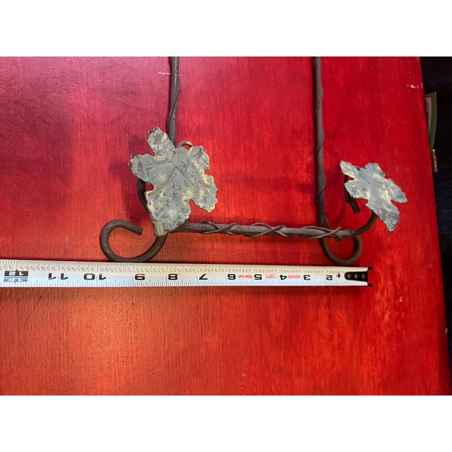 Up for consideration is a beautiful vintage metal wall hanging plate holder with leaf and grape accents. This would look...