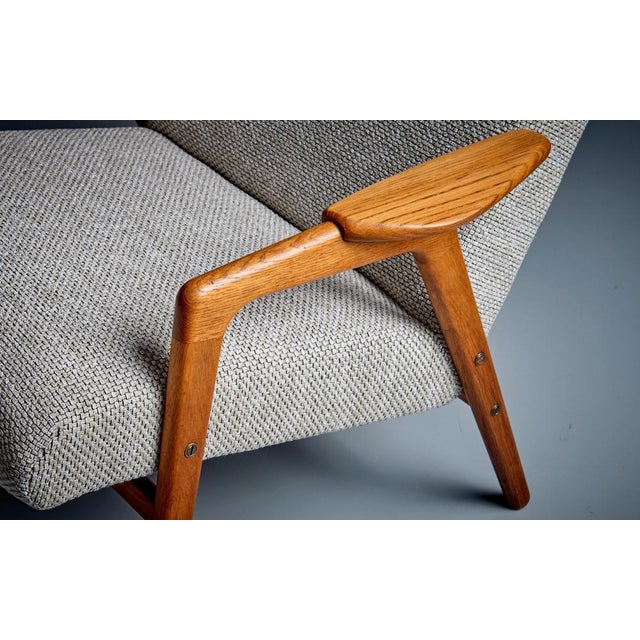 Newly upholstered Yngve Ekström Pair of 'Mingo' Chairs with sculpted wooden frame and beautifully curved armrests. The...