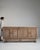 Evoking the refined restraint of mid-century French craftsmanship, this circa 1940 buffet is rendered in warm, richly...