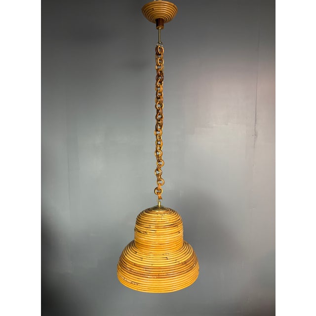 Mid-Century Italian Pencil Reed Rattan Bamboo and Brass Hanging Pendant Lamp, 1970s, in Very Good conditions. Designed...