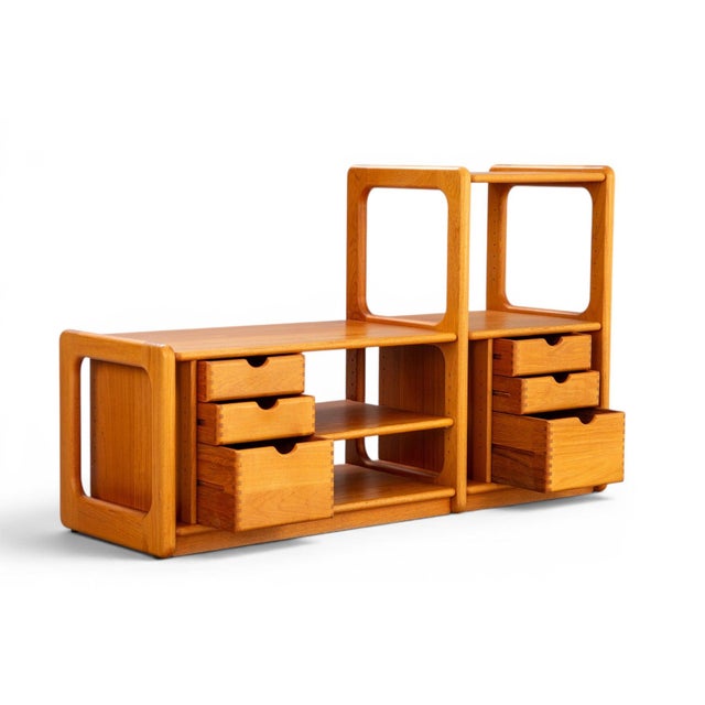 A beautifully crafted 1970s Danish solid teak hi-fi and record storage unit with a distinctive asymmetrical stepped...