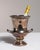 This mid 20th century Neoclassical ice bucket from Spain is finished in silver and gold. It is combining a silvered body...