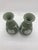 Elegant pair of classic sage green Jasperware vases by the esteemed English maker Wedgwood. Each vase measures...