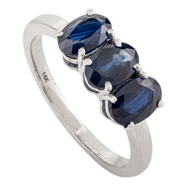 Modern 2 Carat Oval Cut Deep Blue Sapphire Three Stone Ring in 14k White Gold Size 6.5 For Sale
