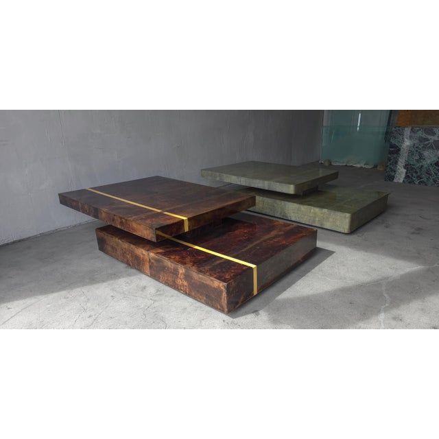 Designed in Italy by Aldo Tura this RARE brown, lacquered goatskin, extending coffee table is fantastic. Tura's use of...