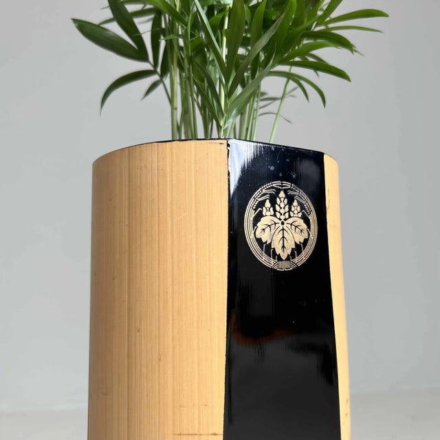 An antique Ikebana flower vase made of bamboo, crafted in Japan during the Showa era (1950s). Dimensions: height 33 cm,...