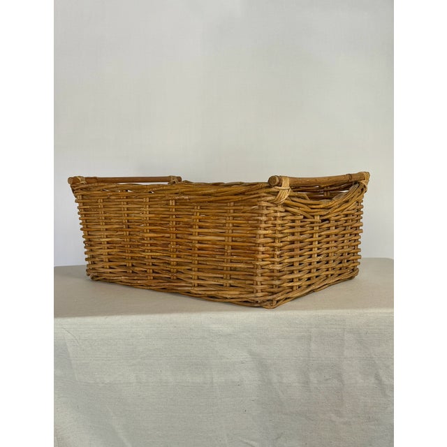 Antique handwoven American wicker basket with hand carved wood handles. Great for shoes, firewood, plants, throws. Very...