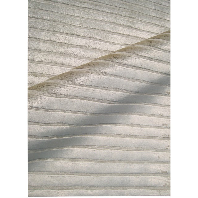 Classic stripes meet luxurious art silk! The perfect foundation to any room, the Gail rug features a carved linear design...