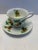 Vintage English bone china teacup and saucer by Windsor, featuring a refined pinecone and pine branch motif with soft...
