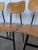 Set of 7 vintage school chairs with a classic mid-century industrial design. The chairs feature a minimalist combination...