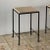 Pair of chic 'Diagramme' travertine drinks tables by Design Frères. Slender powder coated frames fitted with unfilled...