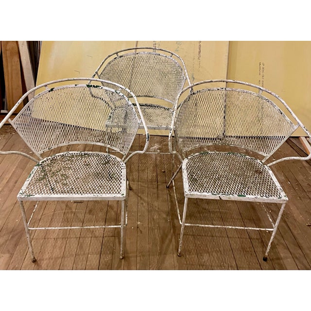 These are a very nice quality and design set of 3 wrought iron chairs with mesh seats and backs. It appears they were...