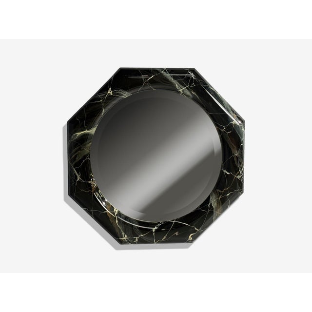 Mid-Century Modern, Octagonal Wall or Console Mirror, Faux Marble Finish, USA, 1980s A modernist sculptural wall mirror...