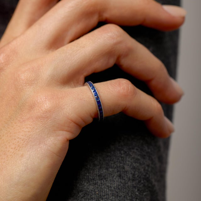 This Art Deco sapphire eternity band is a refined expression of geometry, symmetry, and enduring elegance. A seamless...