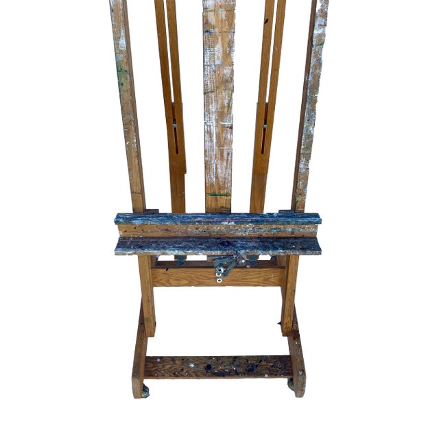 This oversized wood artist's easel has multiple adjustments and on caster wheels. Perfect for displaying large artwork...