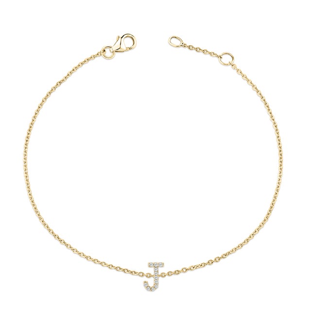 Immerse yourself in the understated elegance of this 10K yellow gold bracelet, for an enrapturing shimmer that captures...