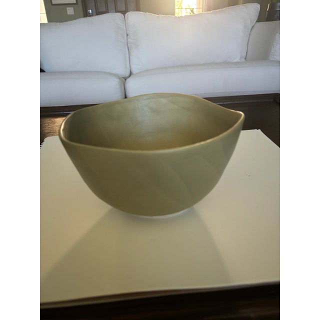 Green pottery bowl by Vance Kitira. Beautiful matte finish.