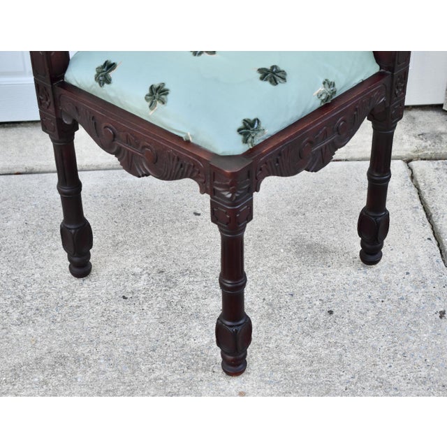 Vintage: 1990's (Reproduction) Corner Chair has a renaissance Style. Made of Wood. Mahogany. Carved Wood.with Figural...