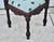 Vintage: 1990's (Reproduction) Corner Chair has a renaissance Style. Made of Wood. Mahogany. Carved Wood.with Figural...