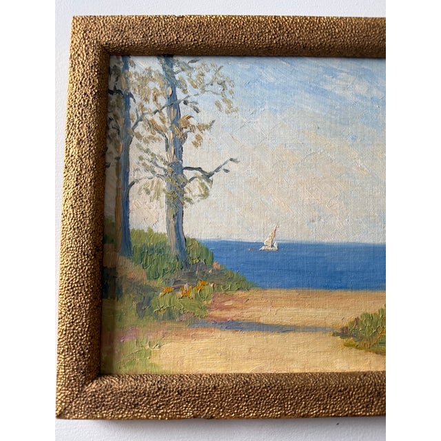 Unsigned impressionist-style lakeshore scene. Oil on board, circa 1920-1940. Presented in an antique gold frame.