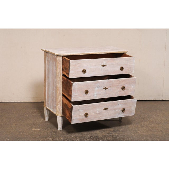 A Swedish Gustavian style wood chest from the turn of the 19th and 20th century. This antique chest from Sweden, in...