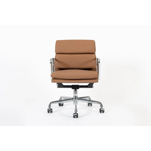 This authentic Eames for Herman Miller Soft Pad Management height brown office chair from the Aluminum Group Collection...