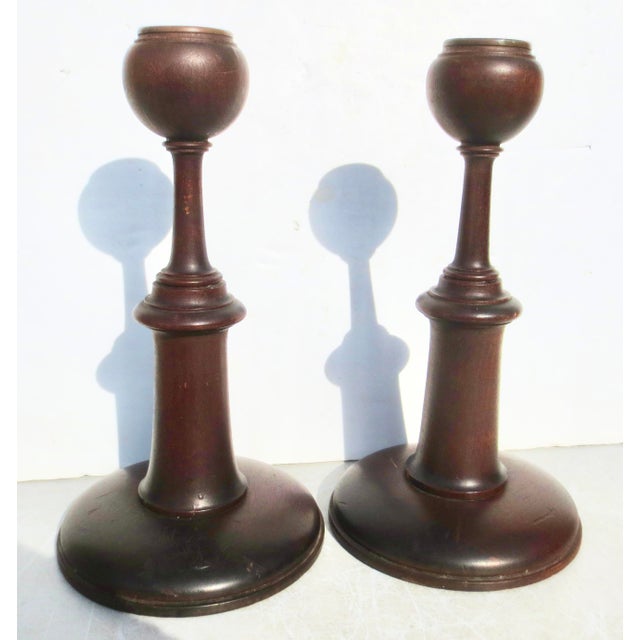 Very fine pair of turned oak candlesticks, Classic proportions with a wide curved base foot and rising column to a step-...