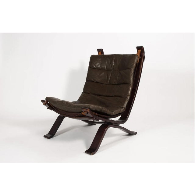 Original Focus sling-type lounge chair, manufactured by Bramin Møbler in the 1970s. The chair contains a dark brown colour...