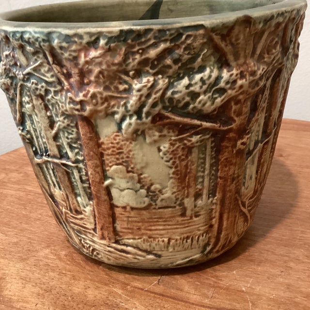 Elevate your home decor with this exquisite antique Weller Art Pottery Ceramic Jardiniere, featuring the charming "Forest"...