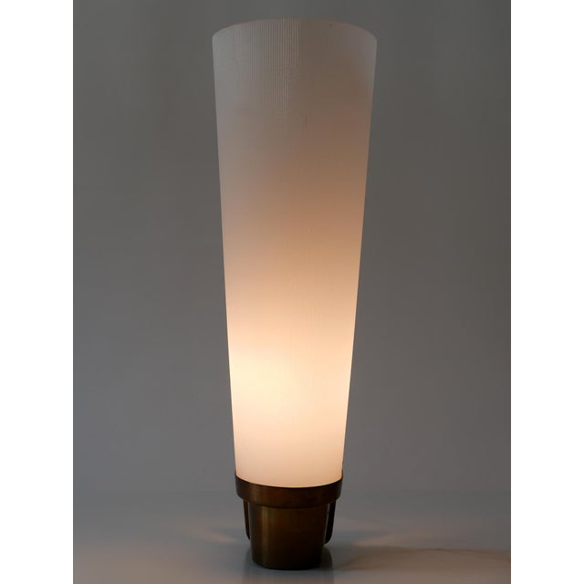 Large and elegant Mid-Century Modern wall lamp or sconce. Manufactured in Germany, 1950s. Executed in brass and acrylic,...