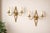 A rare and elegant set of three polished brass wall sconces by Maison Baguès, Paris, dating from the 1950s. These refined...