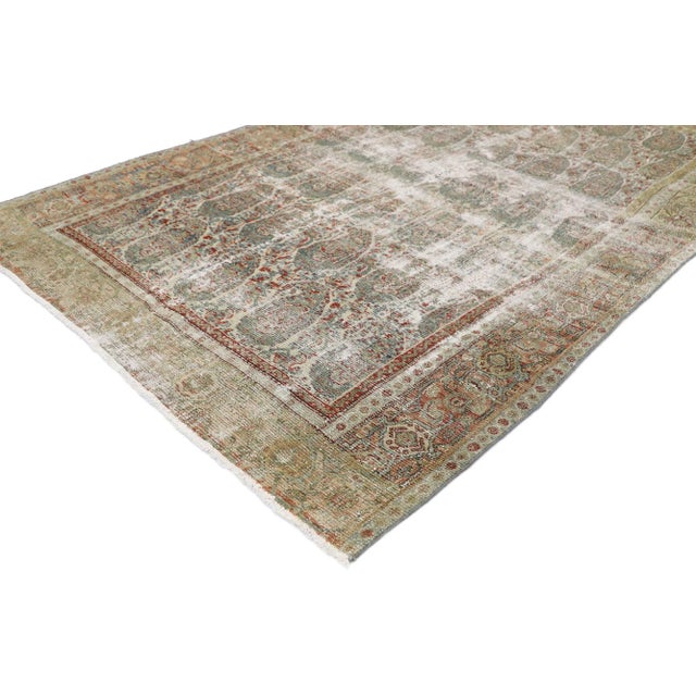 Distressed Antique Persian Senneh Boteh Rug with Rustic Arts & Crafts Style 04'01 x 06'04. Cleverly composed and...