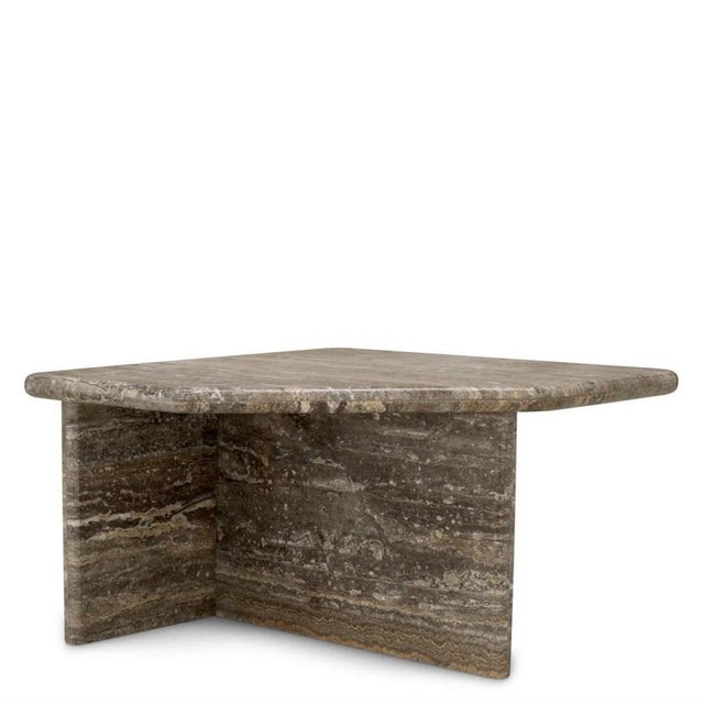 This large free-form coffee table is a sculptural furniture piece made from silver travertine. Each unit features natural...