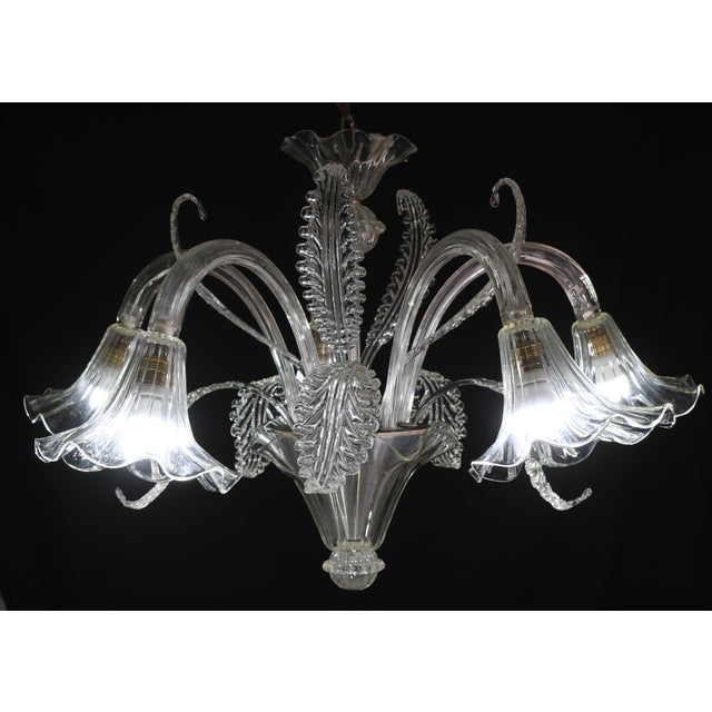 Extraordinary Murano glass chandelier from the middle of the last century. The chandelier consists of 4 tall panels and 5...