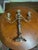 This silver-plated candelabra features a twisted arm design reminiscent of antique Old Sheffield plate styles. Three...