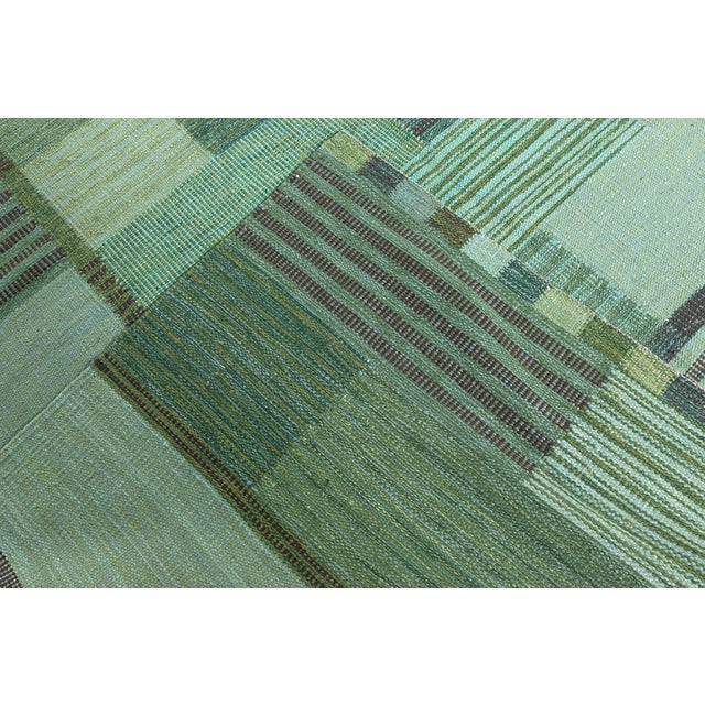 This contemporary Swedish flat weave rug, inspired by the classic Nordic aesthetic, is a celebration of clean geometry,...