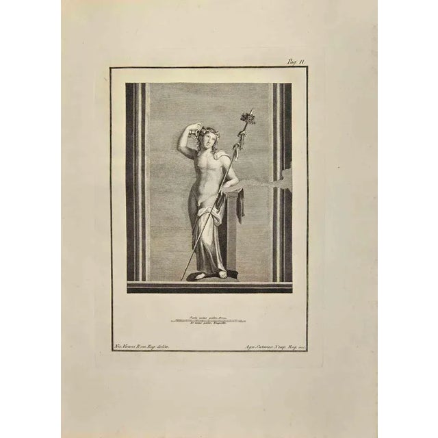 Dionysus Bacchus from "Antiquities of Herculaneum" is an etching on paper realized by Aniello Cataneo in the 18th Century....